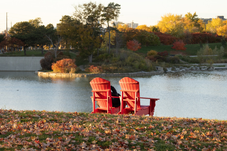 Two chairs shown at Downsview facing a pond