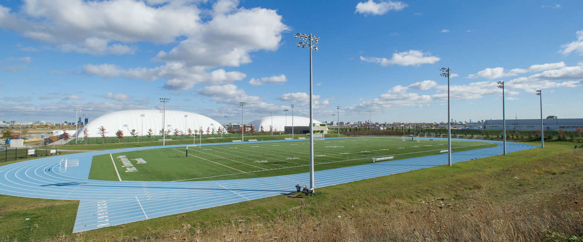 Buildings and a track field at Downsview Park