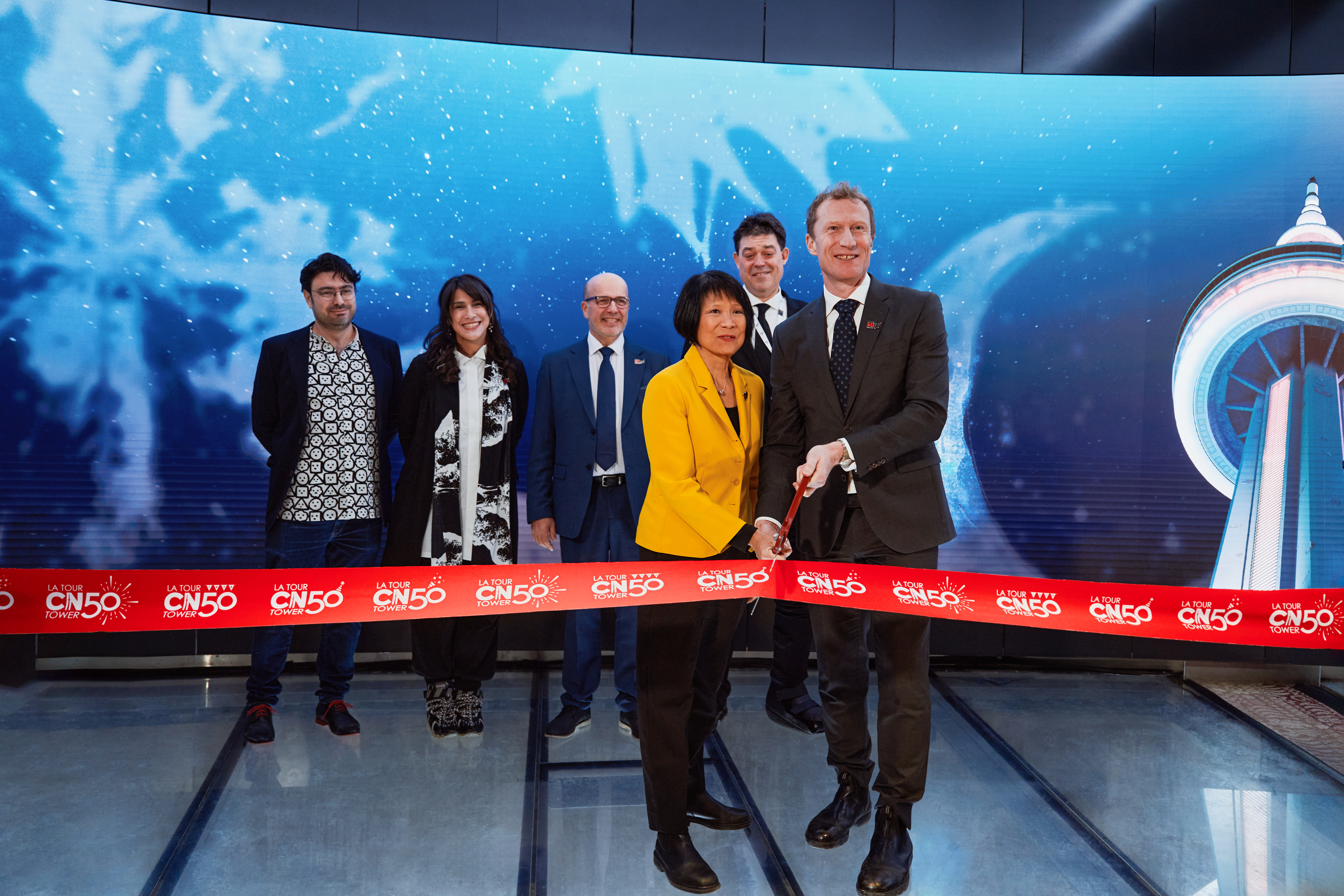 Image showing people standing together for a ribbon cutting event