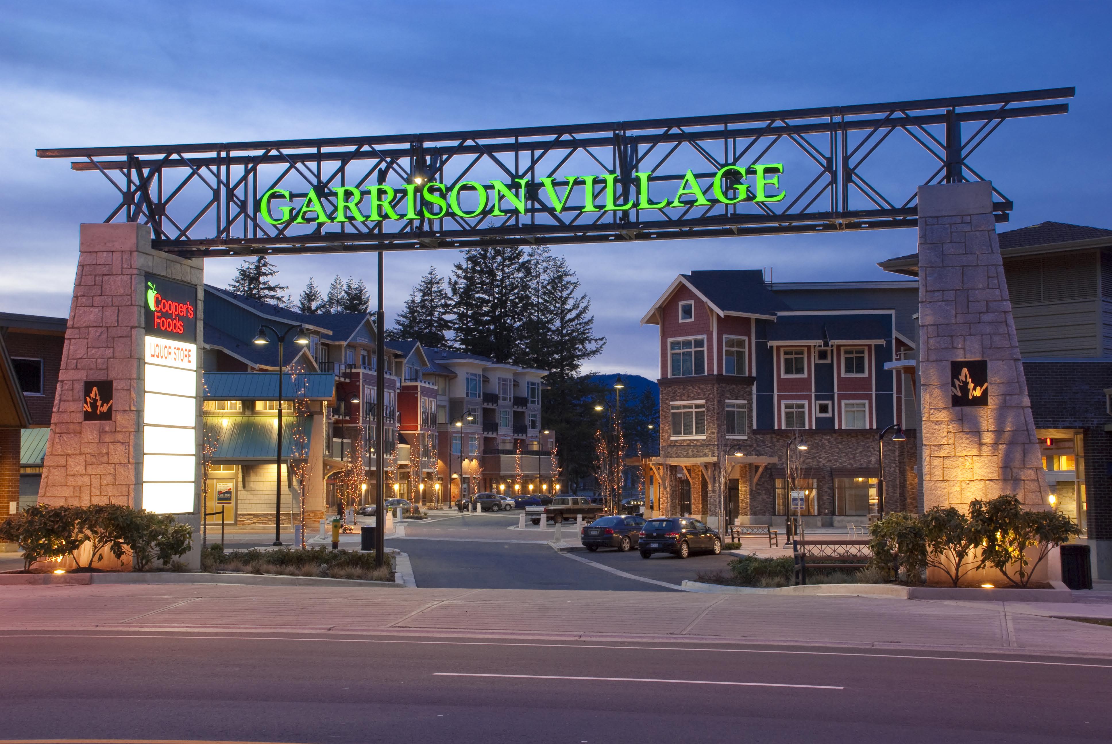 Garrison Crossing entrance with sign showing name