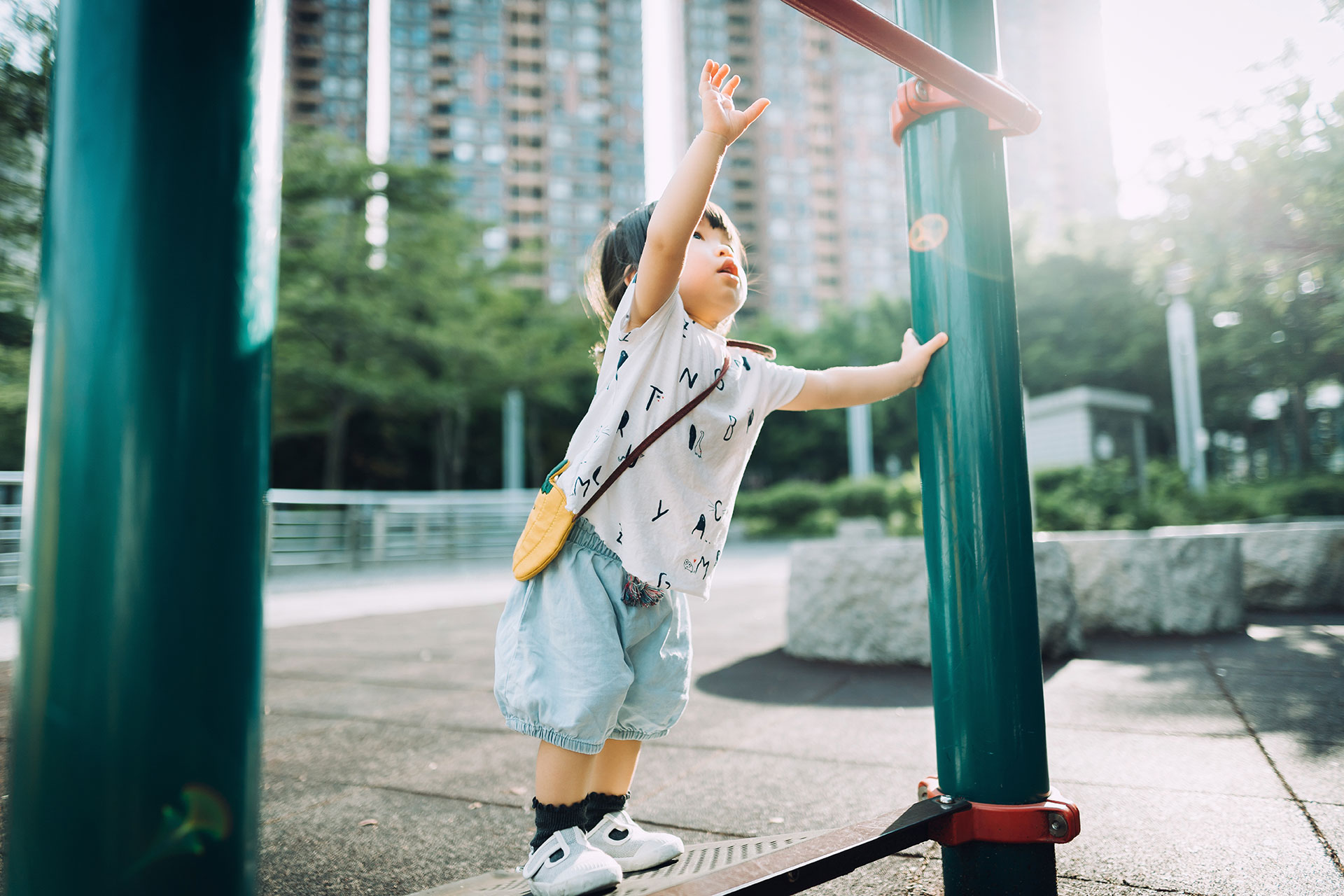 Small child reaching upwards