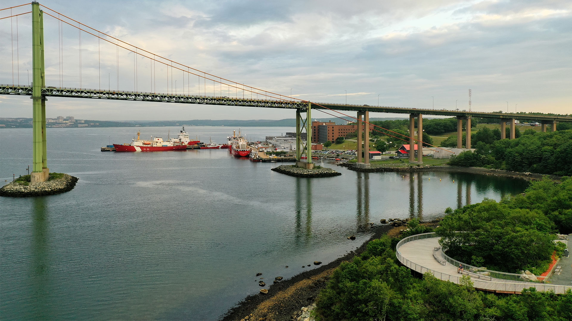 Views of a harbourfront, a bridge and ships