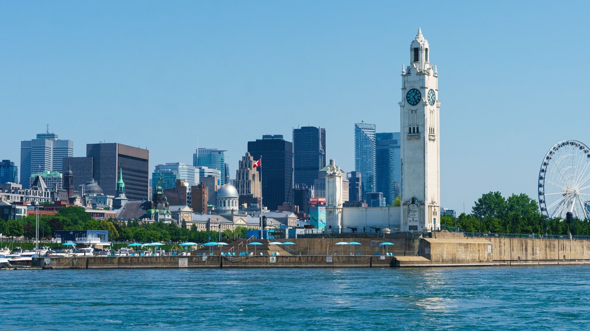 Shot of the Old Port of Montreal showing the clock tower and the cityscape in the background