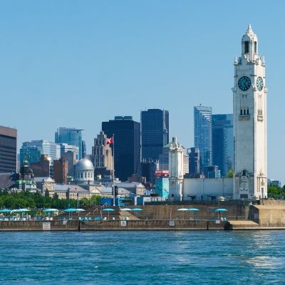 Shot of the Old Port of Montreal showing the clock tower and the cityscape in the background
