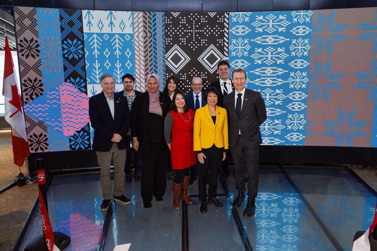 Image showing people standing together for a ribbon cutting event