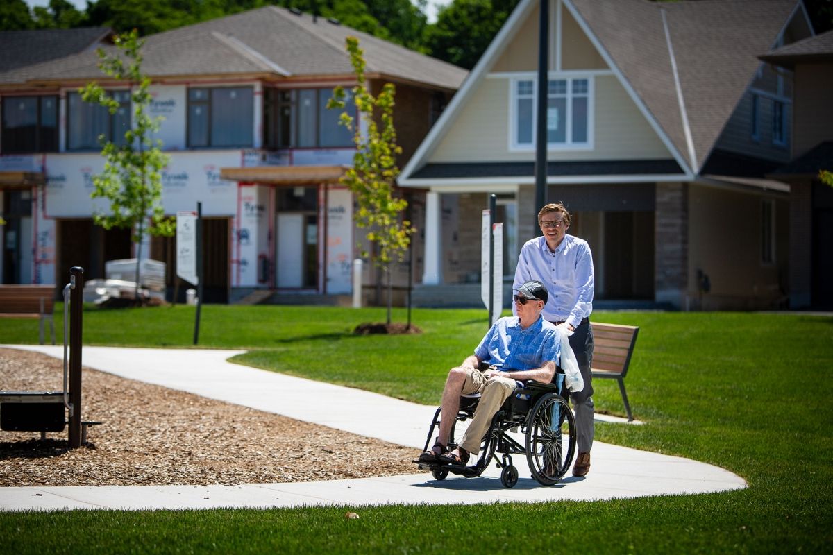 Man being pushed in wheelchair