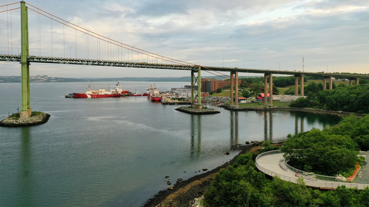 Views of a harbourfront, a bridge and ships