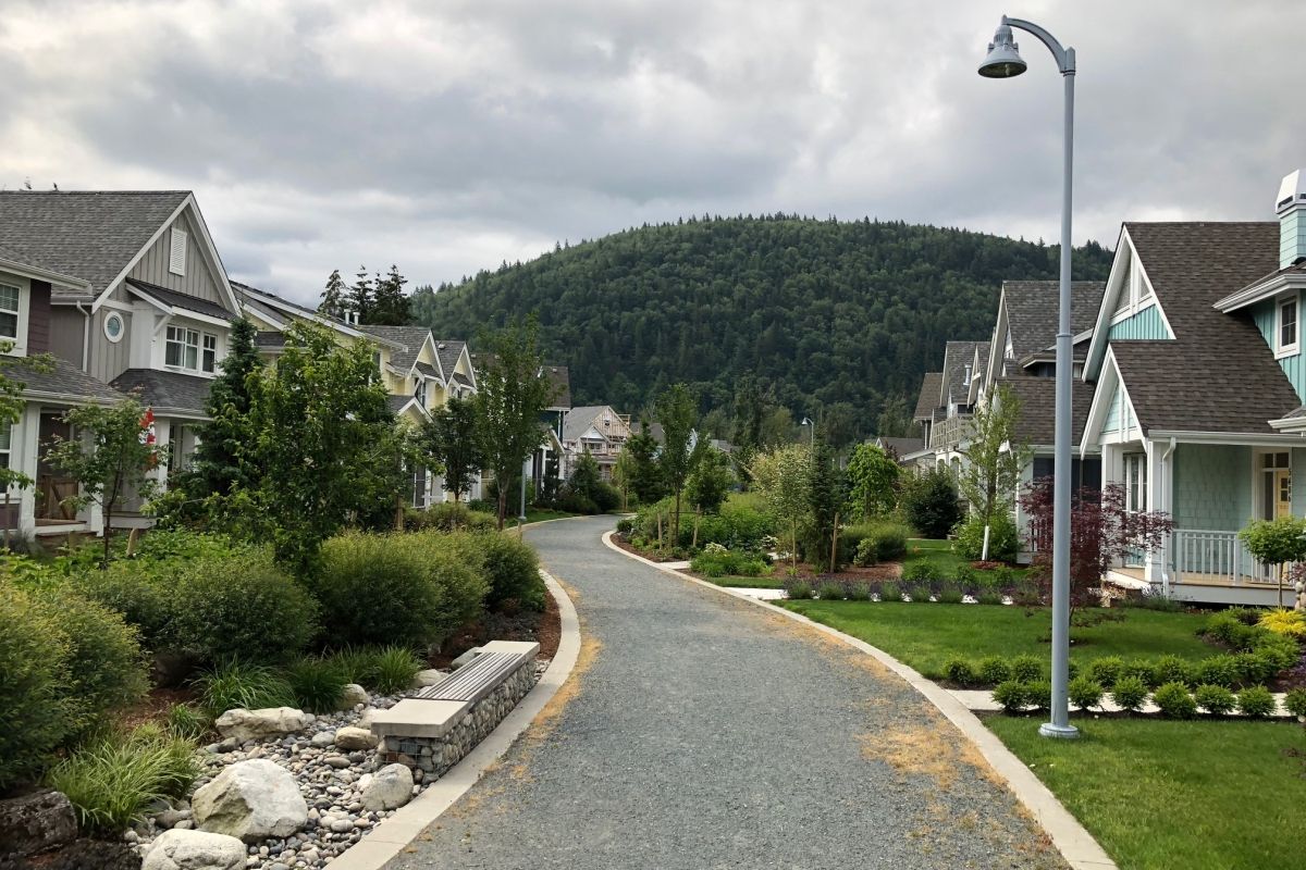 River's Edge showing homes on both sides of a pathway