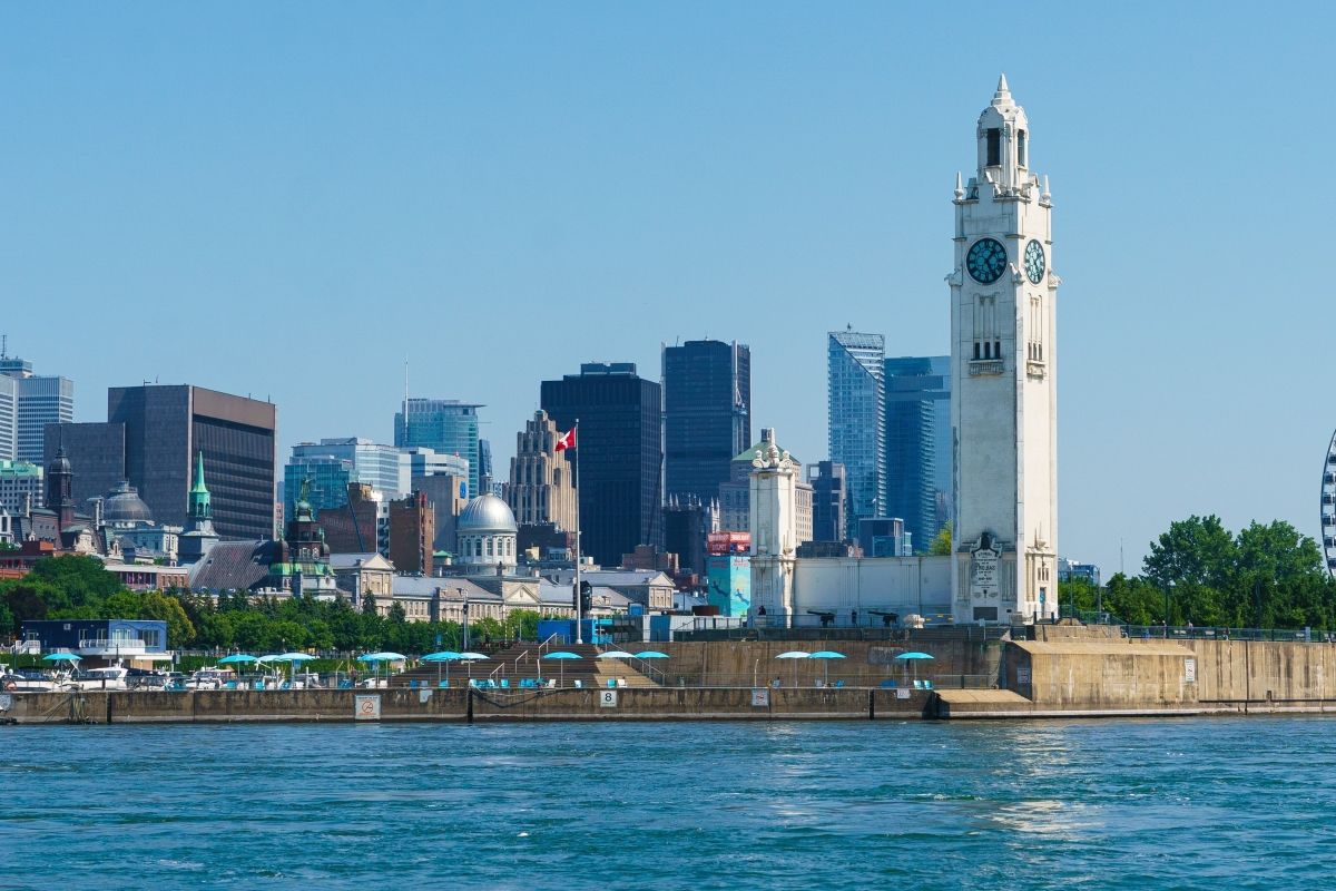 Shot of the Old Port of Montreal showing the clock tower and the cityscape in the background