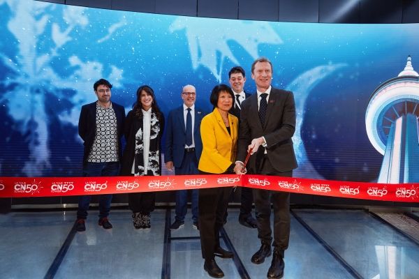 Image showing people standing together for a ribbon cutting event
