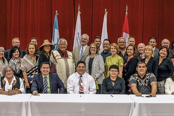 Large group of people seated at a long table
