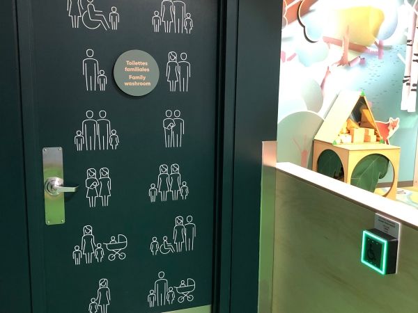 The door to an accessible and gender neutral washroom inside the Mini Mondo exhibition