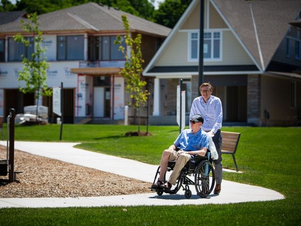 Man being pushed in wheelchair